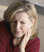 Woman experiencing Facial pain