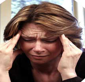 Woman suffering from a Migraine